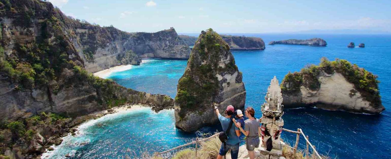 Nusa Penida, Bali, Indonesia. a family taking a selfie at the Thousand Islands Viewpoint