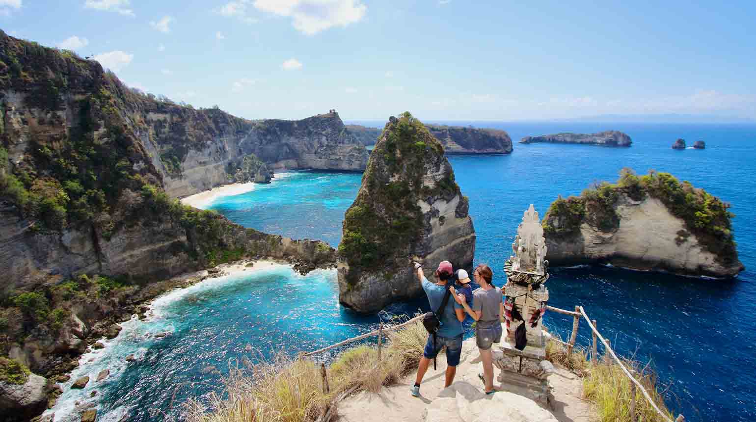 Nusa Penida, Bali, Indonesia. a family taking a selfie at the Thousand Islands Viewpoint